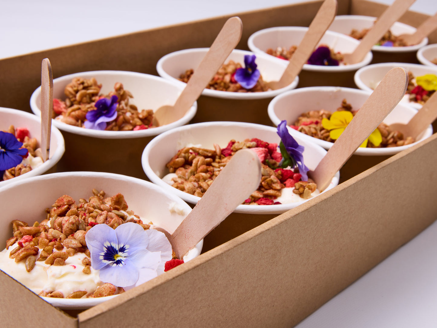 Coconut, ginger & pineapple muesli cups, spiced yoghurt