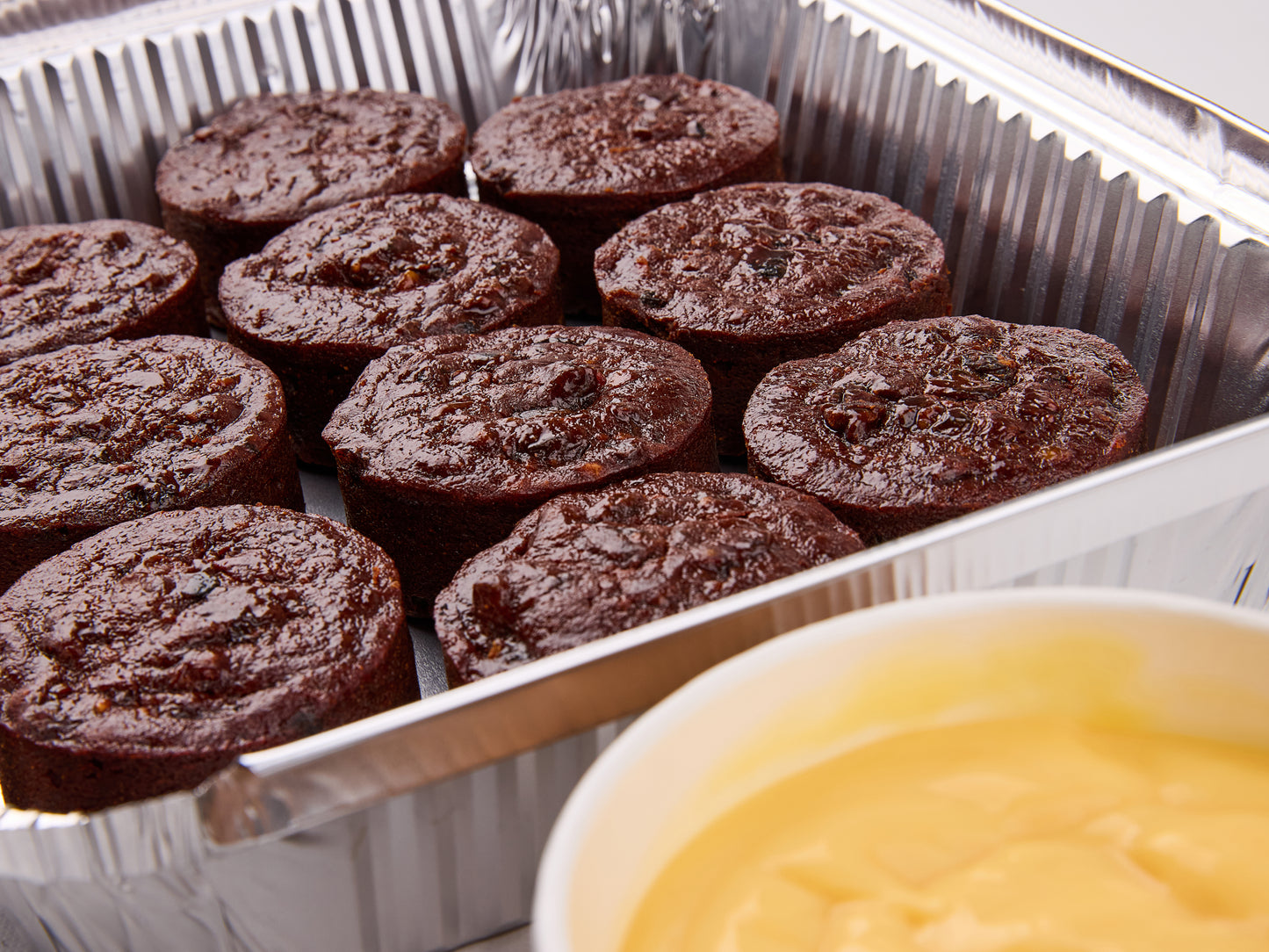 Traditional Plum pudding, served with brandy custard